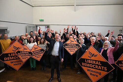Richard Foord MP in front of a large crowd of Lib Dems