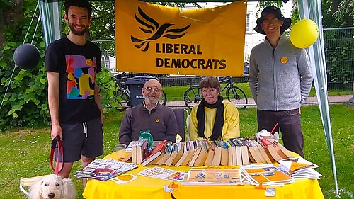 A group of Exeter Lib Dems at their stall at the Respect Festival in Belmont Park, including Will Aczel on the left