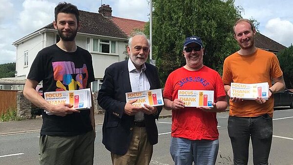 Four Exeter Lib Dems pose with Thank You Focus leaflets on Cowley Bridge Road