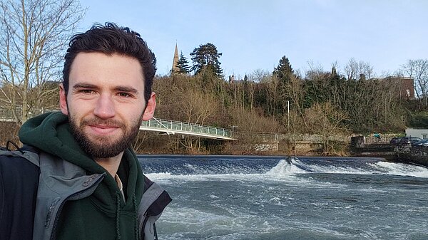 Will Aczel in front of the River Exe by Miller's Bridge