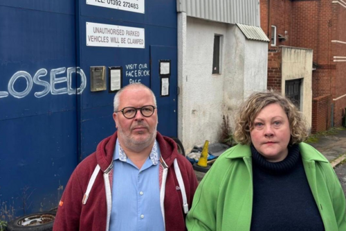 Cllr Kevin Mitchell and Cllr Tammy Palmer outisde the old Vic Street garages site, now proposed tower block